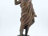 an image of a statue of a man with a gun in his hand