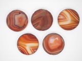 six agite coasters on a white surface with a white background