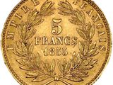 a gold coin with a laurel wreath on top of it