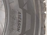 a close up of a tire on a white surface with the words season written on it