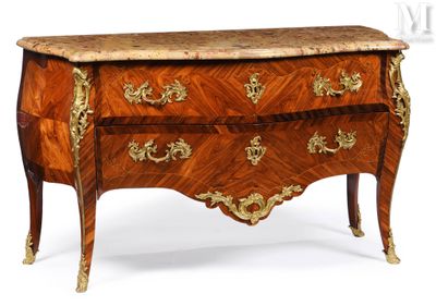 a small chest of drawers with a marble top