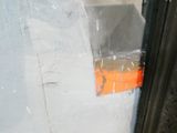 a close up of a piece of plastic on the side of a building