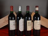 three bottles of wine are lined up on a red table cloth