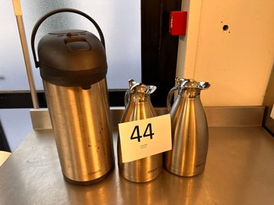 two different types of water bottles on the table