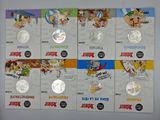 several different types of cartoon coins are on display on a white surface