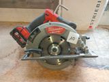 the circular saw is sitting on the floor next to the wall