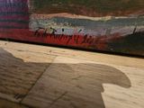 a picture of a painting on a wooden table