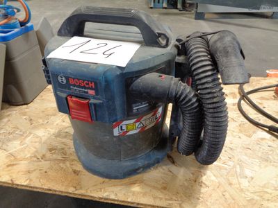 a picture of a blower sitting on top of a wooden table