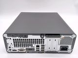 the back view of a computer with a hard drive on top of it