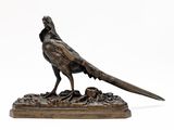bronze sculpture of a pheasant on a rock