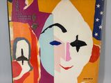 an album with a picture of a clown and a clown face on it