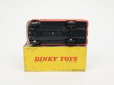a black toy car sitting on top of a yellow box