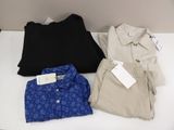 three men ' s shirts are on a table with a price tag