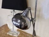 a lamp that is sitting on a table next to a lamp