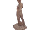 an image of a statue of a woman standing on a white surface