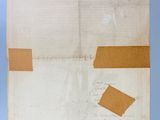 an old piece of paper with a piece of brown tape on it