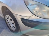 a close up of a car with a denting on it