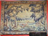 a tapestry hanging on the wall of a room