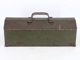 an old metal tool box sitting on top of a white surface