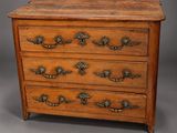 an antique wooden chest of drawers with brass handles