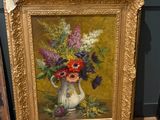 une peinture de fleurs dans un vase sur une table