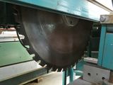 a picture of a machine that is cutting a piece of wood