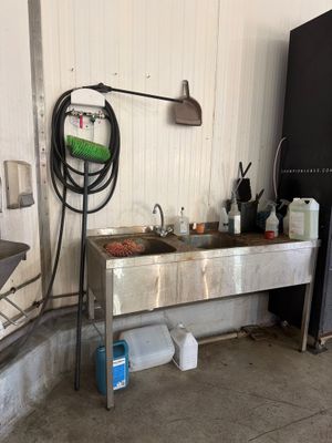 a kitchen with a sink and a refrigerator in it