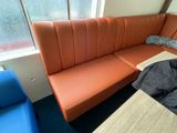 a couch and a table in the corner of a room