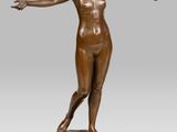 an image of a bronze statue of a woman on a marble base