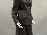 an image of a mannequin wearing a suit and skirt