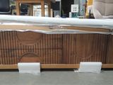 a couch that is being wrapped up and ready to be shipped