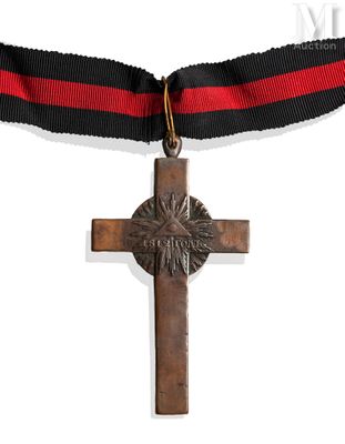 medal with cross and ribbon on white background with red and black ribbon