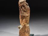 an image of a statue of a man holding a large rock
