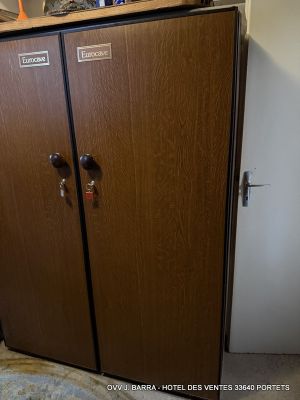 a wooden cabinet with two doors on the top of it