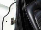 a close up of a car door handle and seat