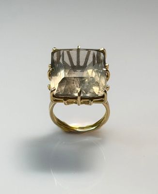 a close up of a ring with a stone in it