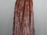 a close up of a fur coat on a mannequin stand