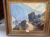 a picture of a painting of a mountain scene in a frame