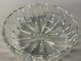 a clear glass bowl with a circular design on it