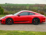 a red sports car parked in a parking lot