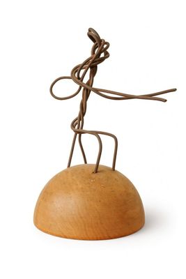 wooden sculpture of a man on a rock with a rope around his neck