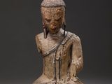 an image of a statue of a person sitting in a meditation position
