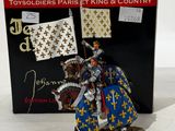 figurine of a knight on a horse with a flag in his hand