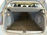the back of a car with the trunk open and the seats down