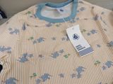 a picture of a baby boy ' s shirt with a tag on it