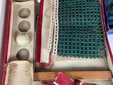 an open box with a green cloth inside of it