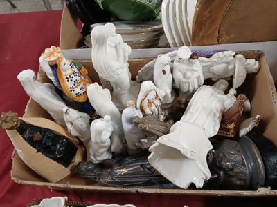 a box full of figurines sitting on a table