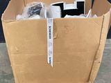 a cardboard box with a computer in it on a pallet