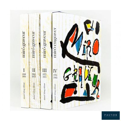 three books are stacked on top of each other on a white surface