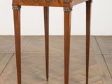 an image of a small wooden table on a parquet floor